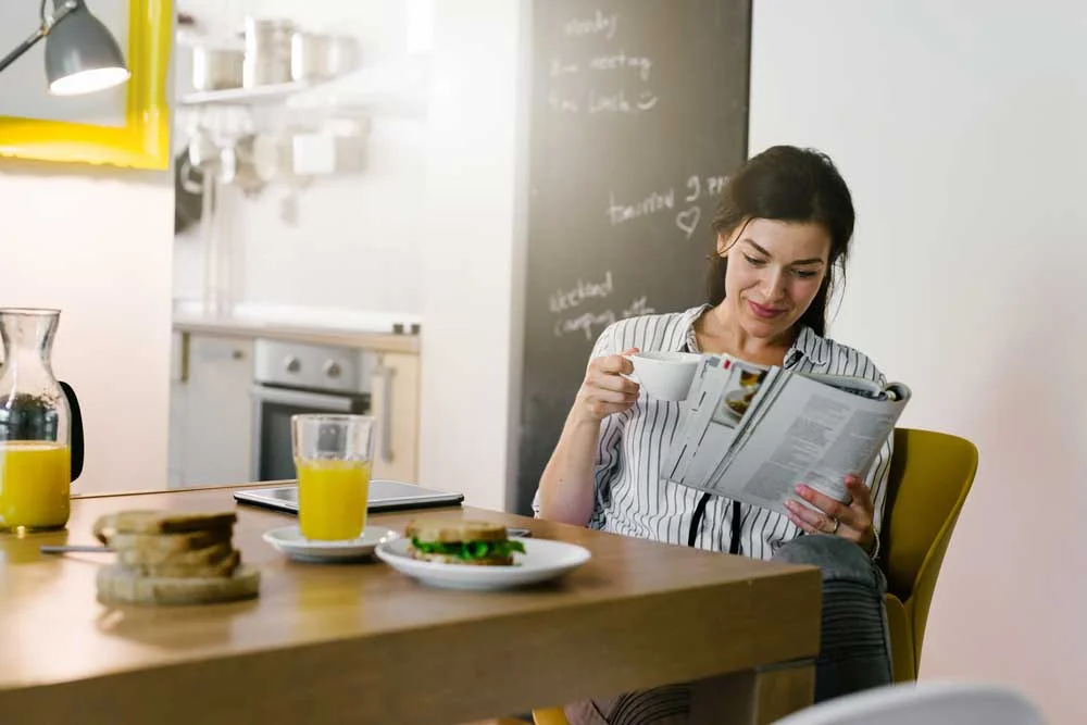 Woman reading newspaper